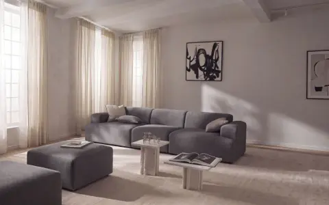 Nowoczesny salon z szarą sofą i pufami, inspiracja jak uzyskać kolor grafitowy w aranżacji.