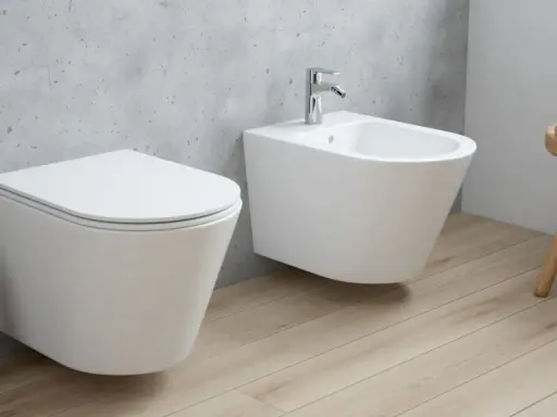 Nowoczesna łazienka z wiszącą miską WC i bidetem. Dowiedz się, bidet co to i jak go używać.